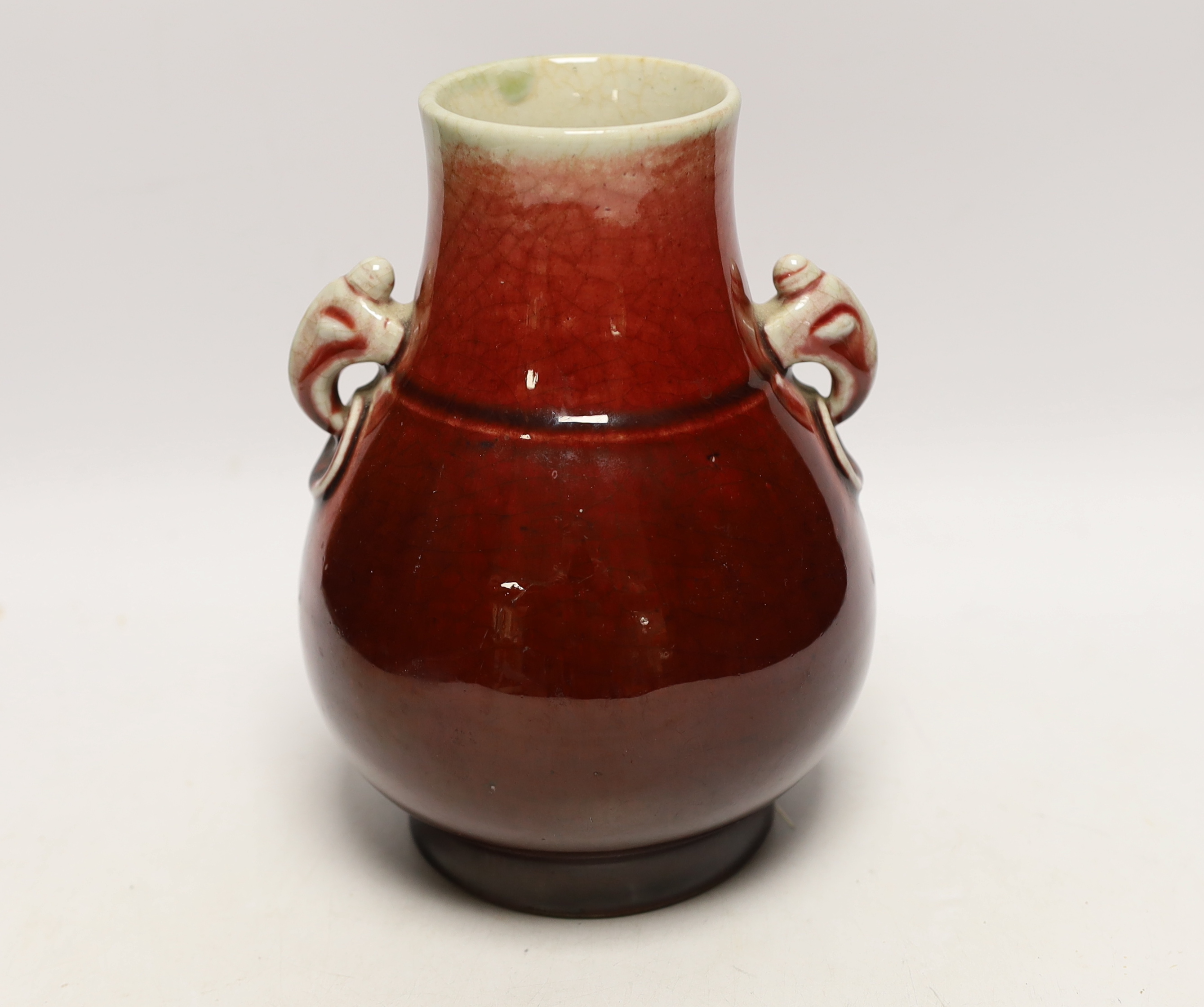 A Chinese sang de boeuf glazed pear-shaped vase, hu, late 19th/early 20th century, 21cm